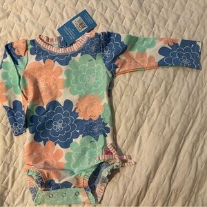 Ruffle Butts Pastel Petals Long Sleeve One-Piece Rash Guard/ Swim Suit. 18-24 mo